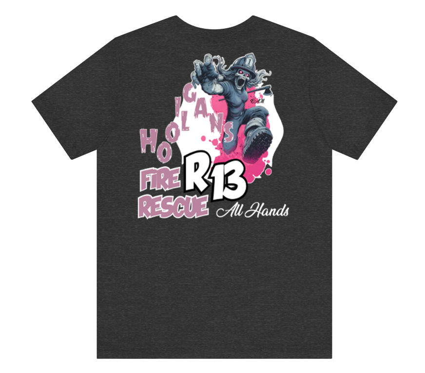 A dark heather gray t-shirt featuring a large graphic print on the front. The graphic depicts a firefighter in a dynamic pose with the text 'HOLICAN FIRE RESCUE', 'R13', and 'All Hands' in pink, white, and black.